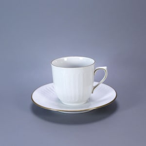 Royal Copenhagen Porcelain Cup and Saucer – Elegant White with Gold Trim