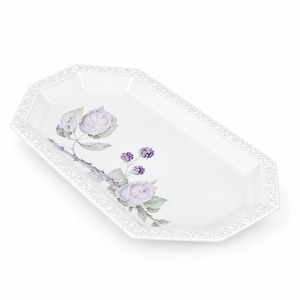 May include: An octagonal white ceramic serving platter featuring a delicate floral pattern of light purple roses and dark purple blackberries with green leaves. The rim of the platter is decorated with a raised, embossed lattice texture.