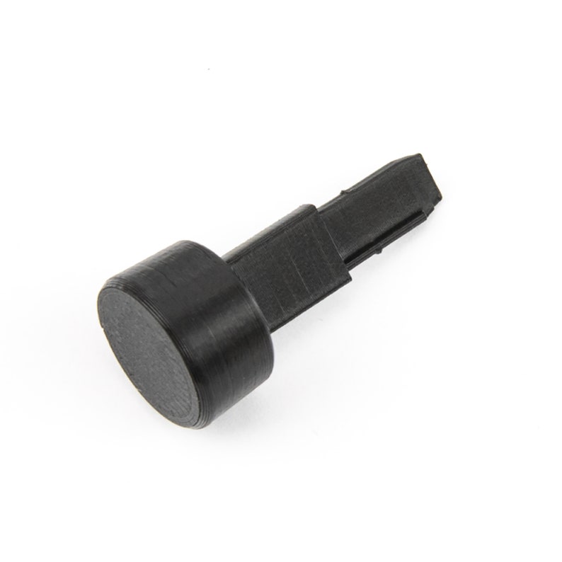 May include: Black plastic furniture leg tip with a round base and a flat top.