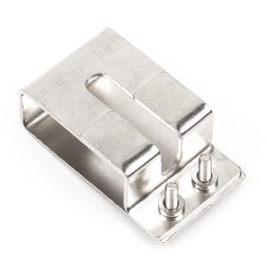 May include: A silver-coloured metal bracket with a U-shaped top and a rectangular base. Two small screws are attached to the base. The bracket is designed to hold or secure something.