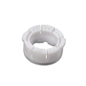 May include: A white, circular plastic component with a series of evenly spaced, rectangular sections. The component has a central opening and a toothed outer edge. The object is set against a plain white background.