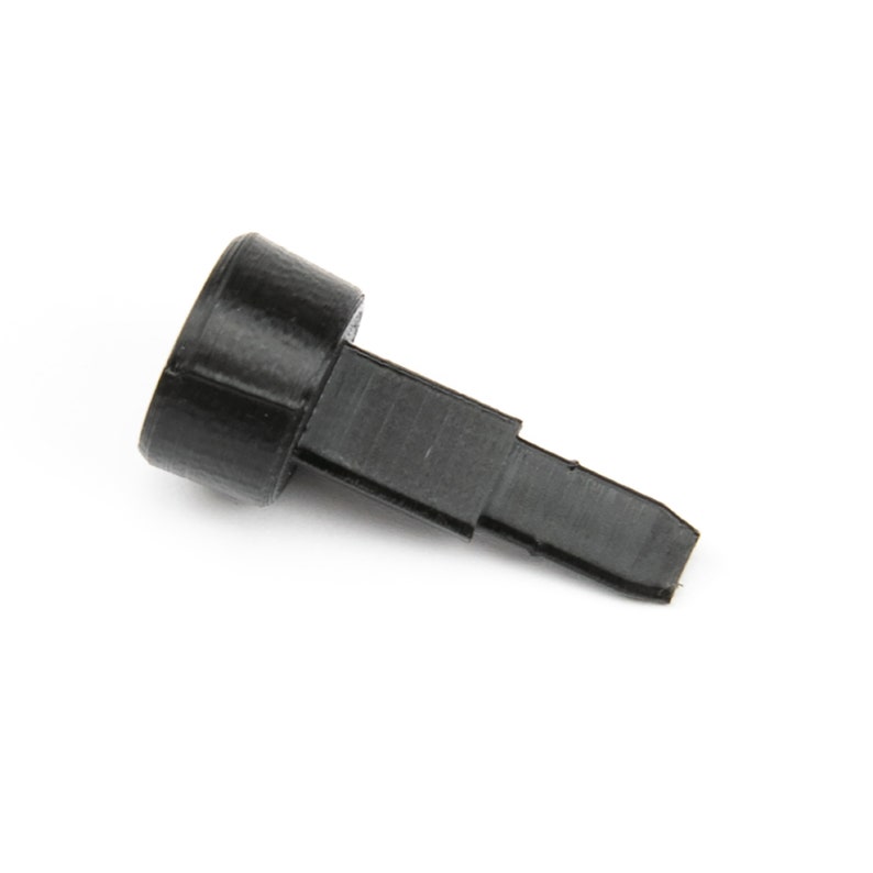 May include: A black plastic pin with a rounded head and a pointed tip.