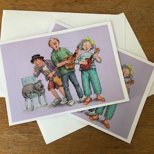 The Music Critic. Een vrolijke kaart met muziekthema, met ukeleles, mandoline en kazoo.