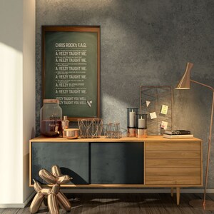 May include: A wooden cabinet with two drawers and a sliding door. The cabinet is decorated with a copper balloon animal, a glass jar with a tap, and a framed chalkboard with the text "CHRIS ROCK's F.A.Q. A: YEEZY TAUGHT ME. YEEZY TAUGHT YOU WELL."
