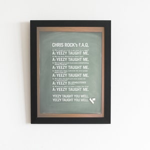 May include: A framed print with a green background and white text. The text reads "CHRIS ROCK's F.A.Q." and includes a series of questions and answers, all of which begin with "A: YEEZY TAUGHT ME."