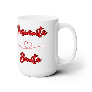 May include: White ceramic mug with a red cursive design that says "Peruquita Bonita" with a small red heart above the word "Bonita".