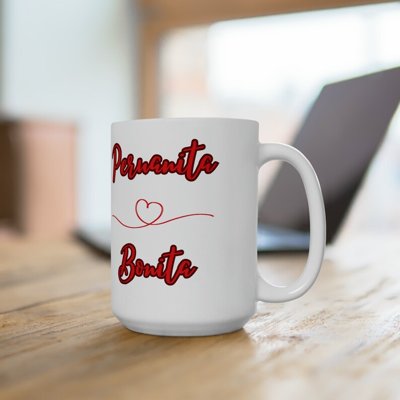 May include: White ceramic mug with a red heart and the text "Peruquita Bonita" in red cursive lettering.