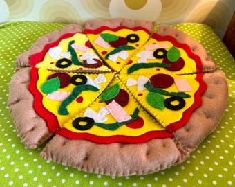 May include: A felt pizza toy with red sauce, cheese, pepperoni, olives, and green peppers. The pizza is divided into eight slices.