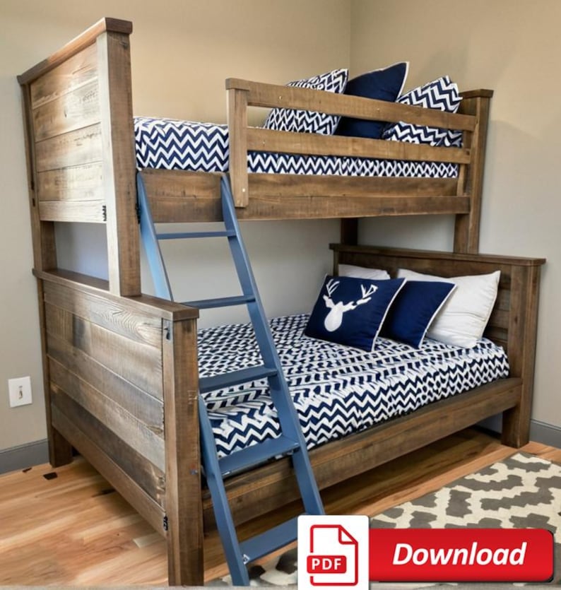 May include: A wooden bunk bed with a blue ladder. The top bunk has a white and blue chevron patterned bedding and the bottom bunk has a white and blue chevron patterned bedding with a white deer head pillow.