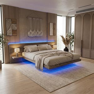 May include: A floating platform bed with a wooden headboard and frame, featuring integrated blue LED lighting underneath. The bed is dressed in neutral-toned bedding and includes two small bedside tables with lamps, set against a wood-panelled wall.