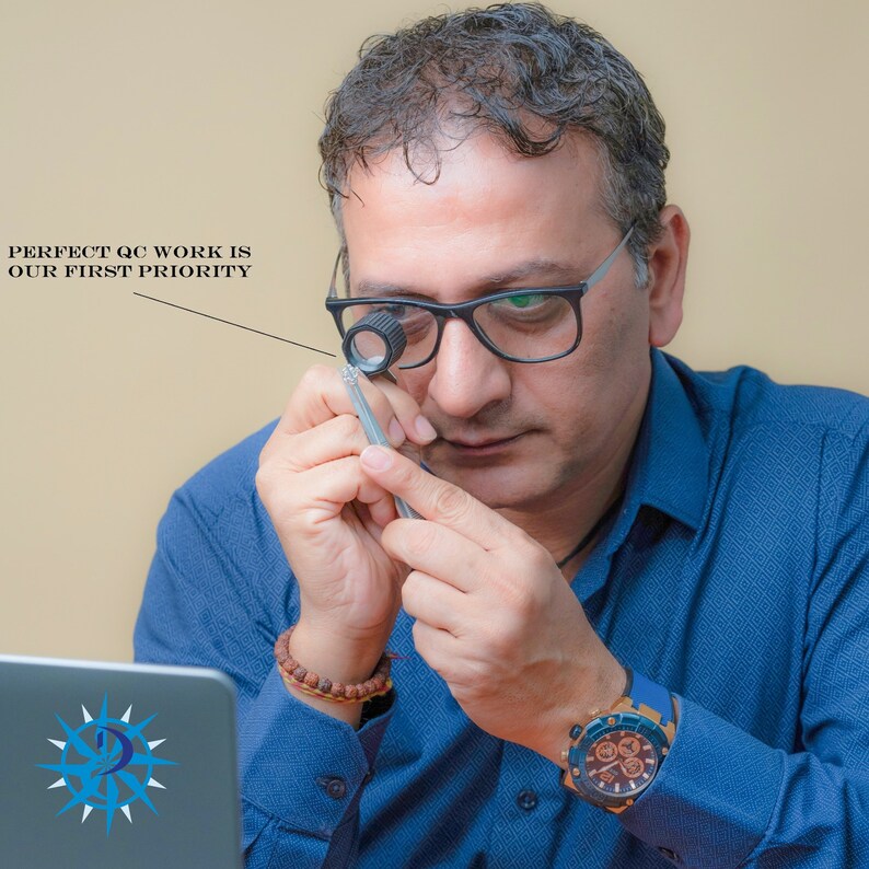 May include: A man wearing a blue shirt and a watch examines a gemstone with a magnifying glass. The text "PERFECT QC WORK IS OUR FIRST PRIORITY" is visible in the image.