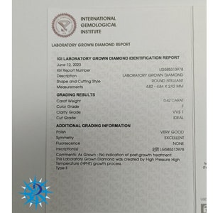 May include: A laboratory grown diamond report from the International Gemological Institute (IGI) for a 0.42 carat, round brilliant diamond. The diamond is graded as F in color, VVS1 in clarity, and Ideal in cut. The report includes additional grading information, such as very good polish, excellent symmetry, and no fluorescence.