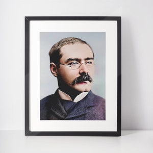 May include: A black and white portrait of a man with a mustache wearing glasses. He is wearing a dark suit and a white collared shirt.