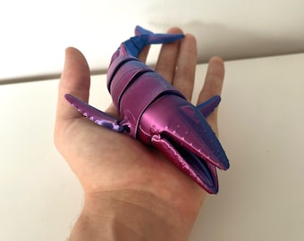 Juguete antiestrés impreso en 3D de ballena articulada