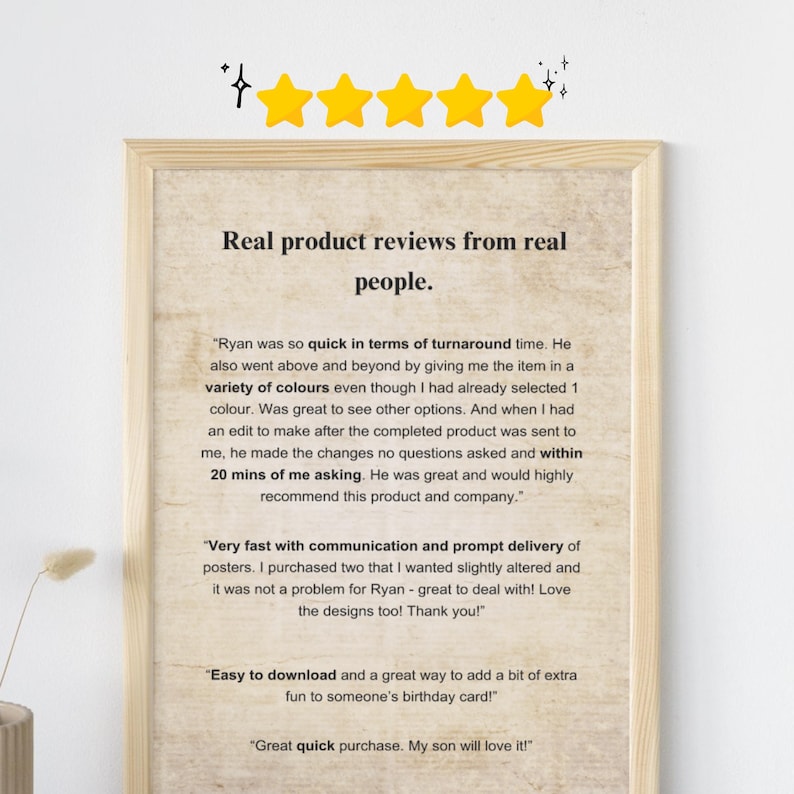 May include: A framed print with customer reviews. The text reads "Real product reviews from real people." The reviews praise quick turnaround, color options, and prompt delivery. The print has a light wood frame and a beige background.