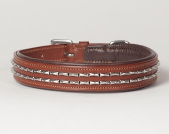 May include: A brown leather dog collar with two rows of silver studs.