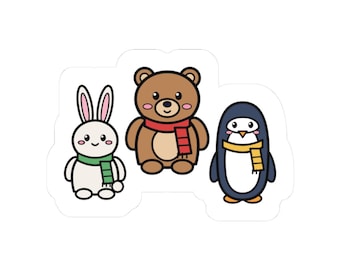 May include: A sticker featuring three cartoon animals: a white rabbit with a green scarf, a brown bear with a red scarf, and a black and white penguin with a yellow scarf. Each animal has a simple, rounded design with pink cheeks and black eyes.