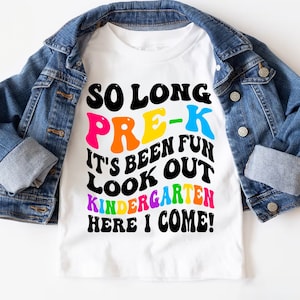 May include: White t-shirt with the text "So Long Pre-K It's Been Fun Look Out Kindergarten Here I Come!" in rainbow colors.
