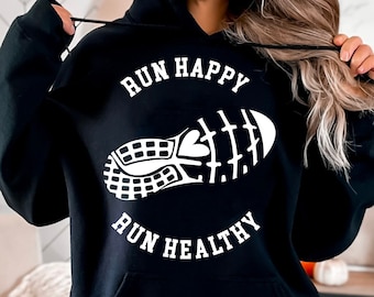 Puede incluir: Sudadera con capucha negra con un gráfico blanco de una zapatilla para correr y el texto "Run Happy Run Healthy".
