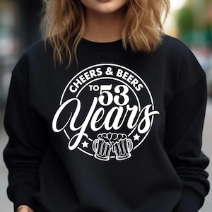 May include: Black sweatshirt with white text that reads "Cheers & Beers to 53 Years" with a graphic of two beer mugs.