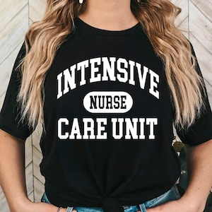 May include: Black t-shirt with white text that reads "INTENSIVE NURSE CARE UNIT".