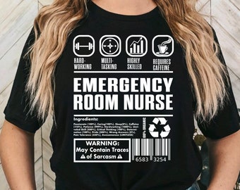 May include: Black t-shirt with white text that reads "Hard-Working, Multi-Tasking, Highly Skilled, Requires Caffeine, Emergency Room Nurse". The shirt also has a graphic with a barbell, compass, bar graph, and coffee cup. The text "Ingredients" and "Warning: May Contain Traces of Sarcasm" is also included on the shirt.