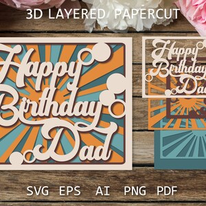 May include: A 3D layered papercut card with a sunburst design and the text "Happy Birthday Dad". The card is made of beige cardstock with orange and blue accents.
