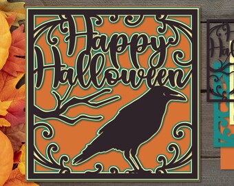 May include: A layered paper cut design with a Halloween theme. The design features the words "Happy Halloween" in a decorative font, a black raven, and decorative swirls. The background is orange, with a black and green border. The bottom of the image includes the text "SVG EPS AI PNG".