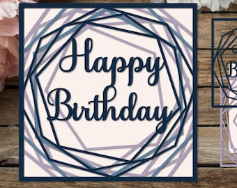 May include: A layered paper cut design with the words "Happy Birthday" in a script font. The design features geometric shapes in shades of blue and purple, set against a cream background. The image also includes the file types SVG, EPS, AI, and PNG.