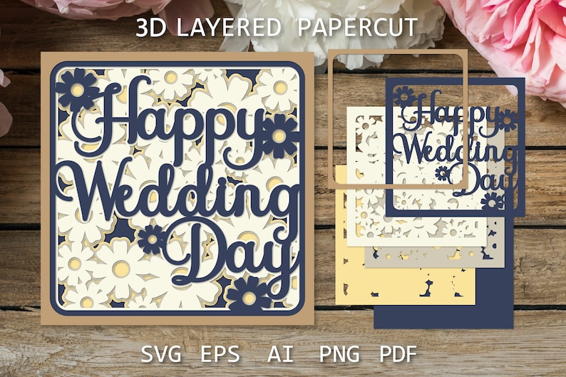以下が含まれることがあります： 白い背景に花柄が施され、紺色の文字で「Happy Wedding Day」と書かれた3Dレイヤーペーパーカットデザイン。デザインは、茶色、白、黄色、青など、さまざまな色の紙を重ねて作られています。