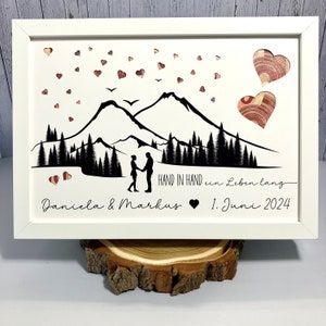 Money gift for the wedding | personalized with name and date | with mountains and punched out hearts and saying hand in hand for a lifetime