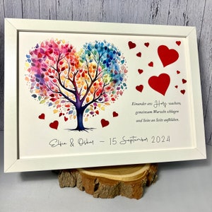 Money gift for the wedding personalized with colorful wedding tree and punched out hearts optionally in a picture frame as a souvenir feuerrot