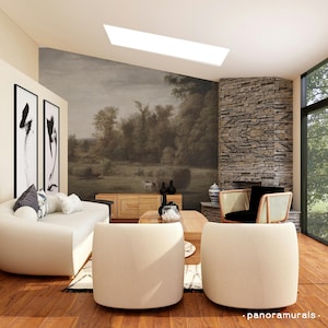 Può includere: Un moderno soggiorno con un grande murale paesaggistico, un divano bianco con cuscini decorativi e due poltrone color crema. Un camino in pietra e una grande finestra offrono luce naturale. La stanza presenta mobili in legno e opere d'arte in bianco e nero.