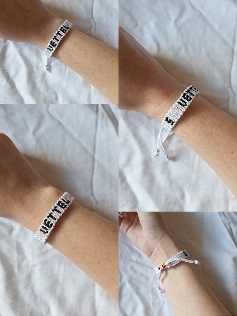 May include: White friendship bracelet with black lettering that reads "VETTEL".