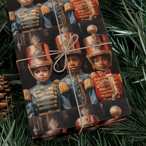 May include: Christmas gift wrap featuring a dark background with a repeating pattern of young Black children dressed in vintage military-style uniforms. The children are depicted in a regal and sophisticated manner, wearing blue, red, and gold uniforms with intricate details. The wrapping paper is tied with a simple twine bow, adding a touch of rustic elegance. This design is perfect for adding a touch of festive cheer to your holiday celebrations.
