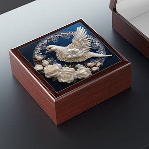 May include: A wooden box with a dove and white roses design on the lid. The box is open and the inside is lined with white fabric.