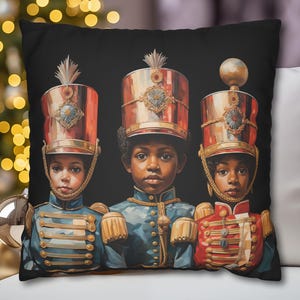 May include: Black decorative throw pillow featuring a digital painting of three children in military-style uniforms and tall hats. The uniforms are blue and red with gold accents. The hats are red and gold.