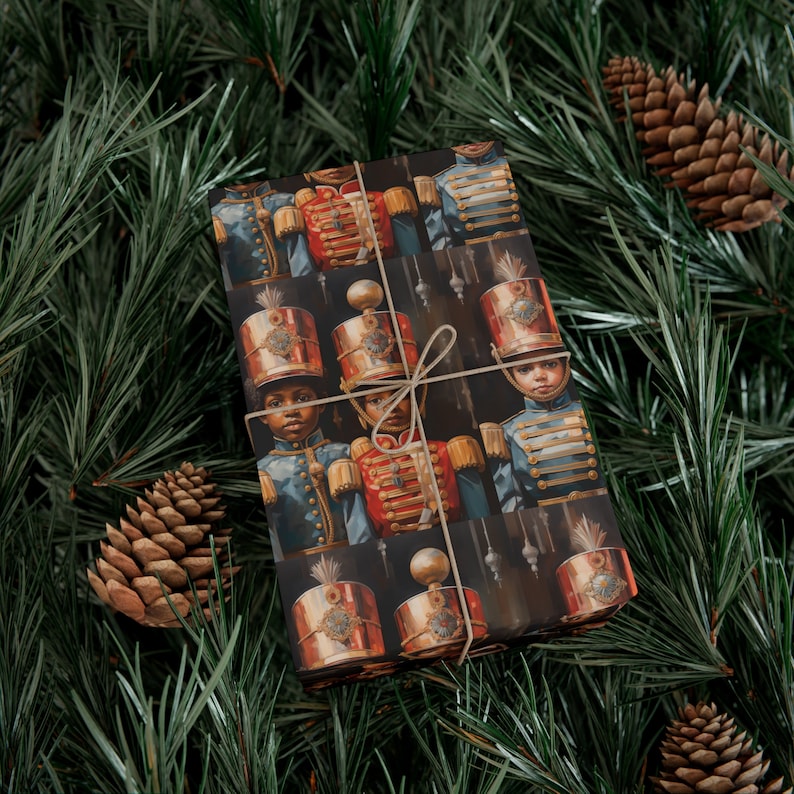May include: Christmas gift wrap featuring a repeating pattern of vintage-style toy soldier illustrations. The soldiers are depicted in dark blue and red uniforms with gold accents, set against a dark background. The paper is tied with a simple twine bow.  The design is richly detailed and evocative of classic holiday imagery.
