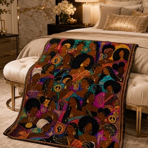 May include: A rectangular throw blanket featuring a vibrant, multi-colored collage of Black women with diverse hairstyles, adorned with gold jewelry and accessories. The design incorporates symbols like peace signs, raised fists, and black panthers.