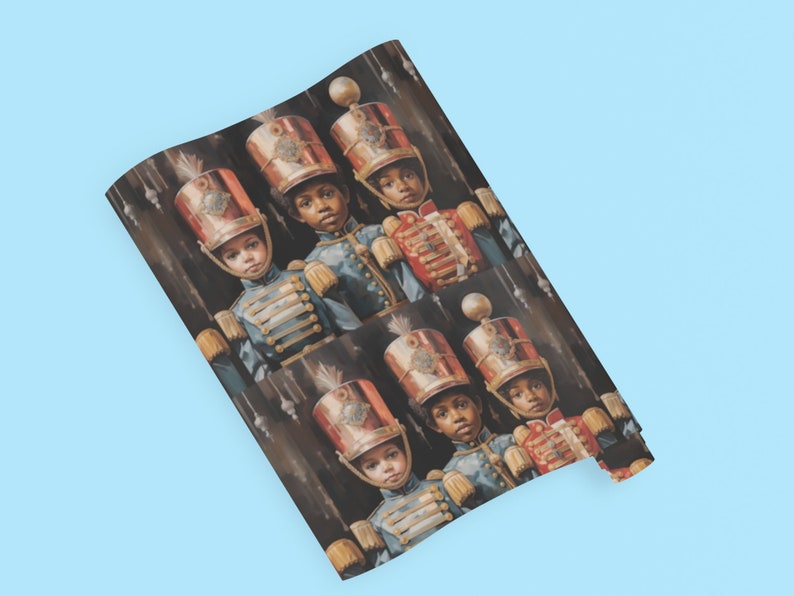 May include: Wrapping paper featuring a repeating pattern of young children dressed in vintage-style military uniforms. The children wear ornate, red and gold hats and blue jackets with gold detailing. The background is dark, enhancing the rich colors of the uniforms. The overall style is reminiscent of classic holiday imagery, making it suitable for gift-wrapping during the festive season.