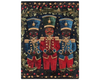 May include: A rectangular print featuring three nutcracker figures in uniform. The central figure wears a red coat and green hat, flanked by two figures in blue coats and blue hats. They are framed by a dark border of holly leaves and red berries.