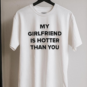 My Girlfriend Is Hotter Than You – Funny Couple Gift, Edgy Unisex Graphic Tee – Bold and Funny Festival Rave T-Shirt – Dual Karma