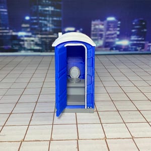 Baño público móvil portátil azul a escala 1:24, inodoro químico portátil azul
