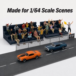 May include: A 1/64 scale miniature set featuring a dark blue stadium bleacher filled with diverse figures, a chain-link fence, and two toy muscle cars on a gray track. The text "Made for 1/64 Scale Scenes" is printed at the top of the image.