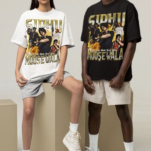 May include: Two people wearing black and white t-shirts with a graphic print of a group of people and the text "Sidhu Moosewala". The people in the image are wearing white and beige shorts and white sneakers.