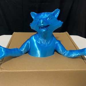 Rocket printed in silk blue. 10.5 inches wide