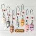 see more listings in the PHONE CHARM & KEYCHAIN section