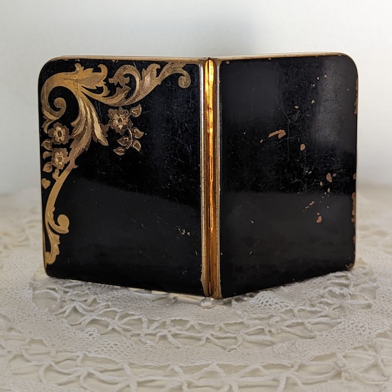 Vintage black and gold compact