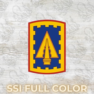 May include: A shield-shaped emblem with a blue center, a yellow border, and a red outline. A yellow arrowhead design is centered within the blue field. The text "SSI FULL COLOR" is displayed at the bottom.