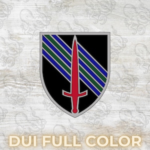 May include: A shield-shaped emblem with a black background, a silver border, and a red sword. Diagonal stripes of blue and green are on the top left. The text "DUI FULL COLOR" is at the bottom.